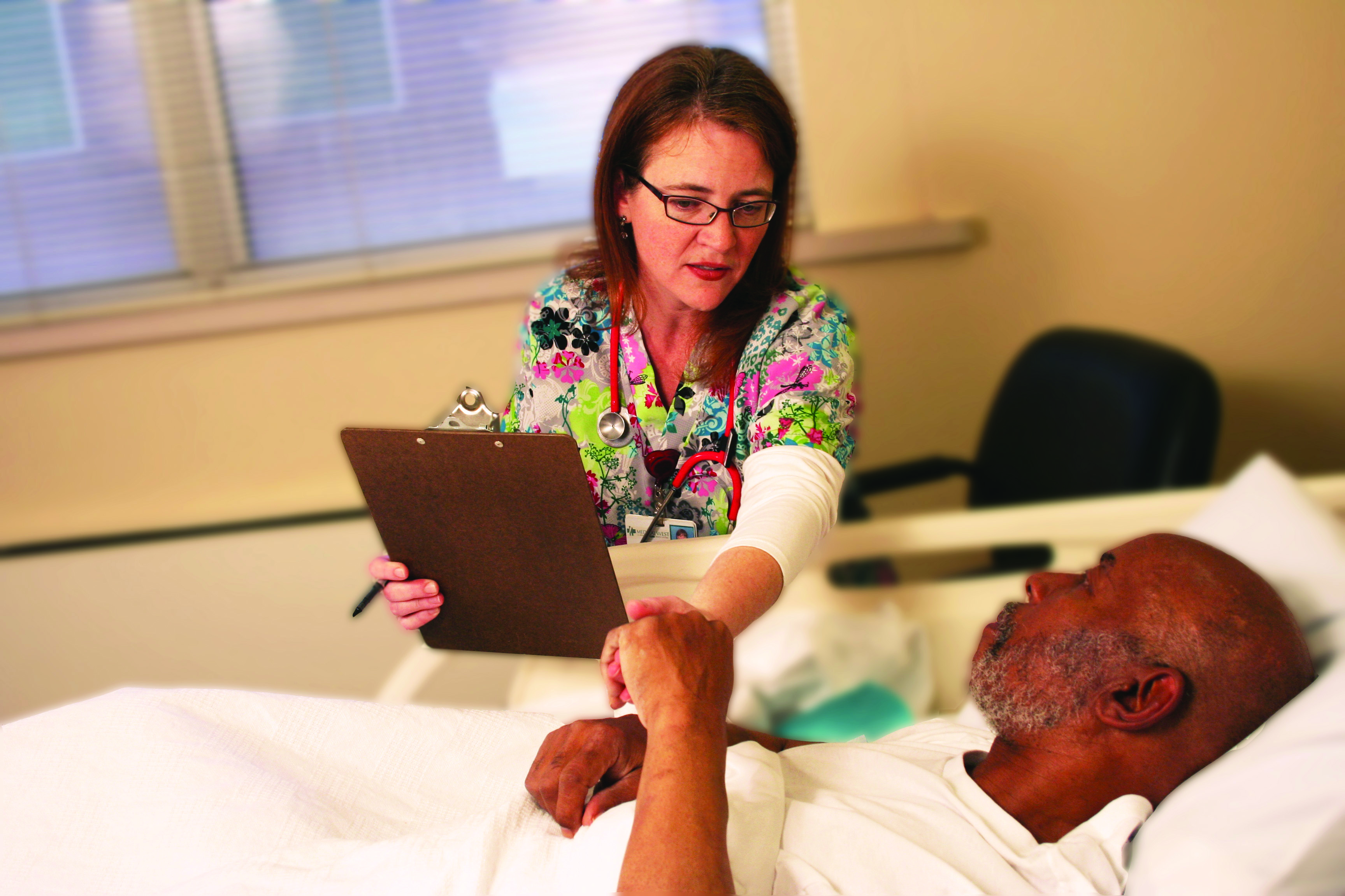 A specialized nurse assists a patient in the Geriatric Psychiatry Unit at UAB UAB Medical West facility